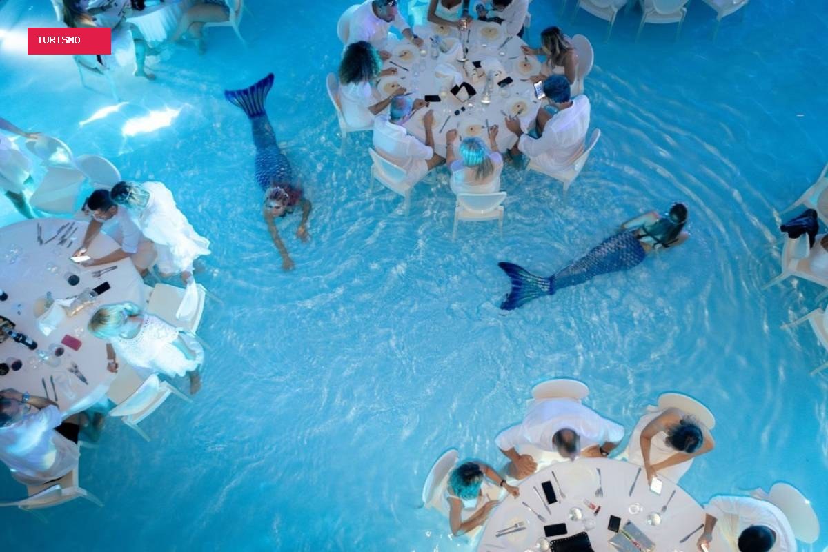Jantar dentro de piscina com 'sereia' entre mesas viraliza e rende piadas no Brasil; conheça